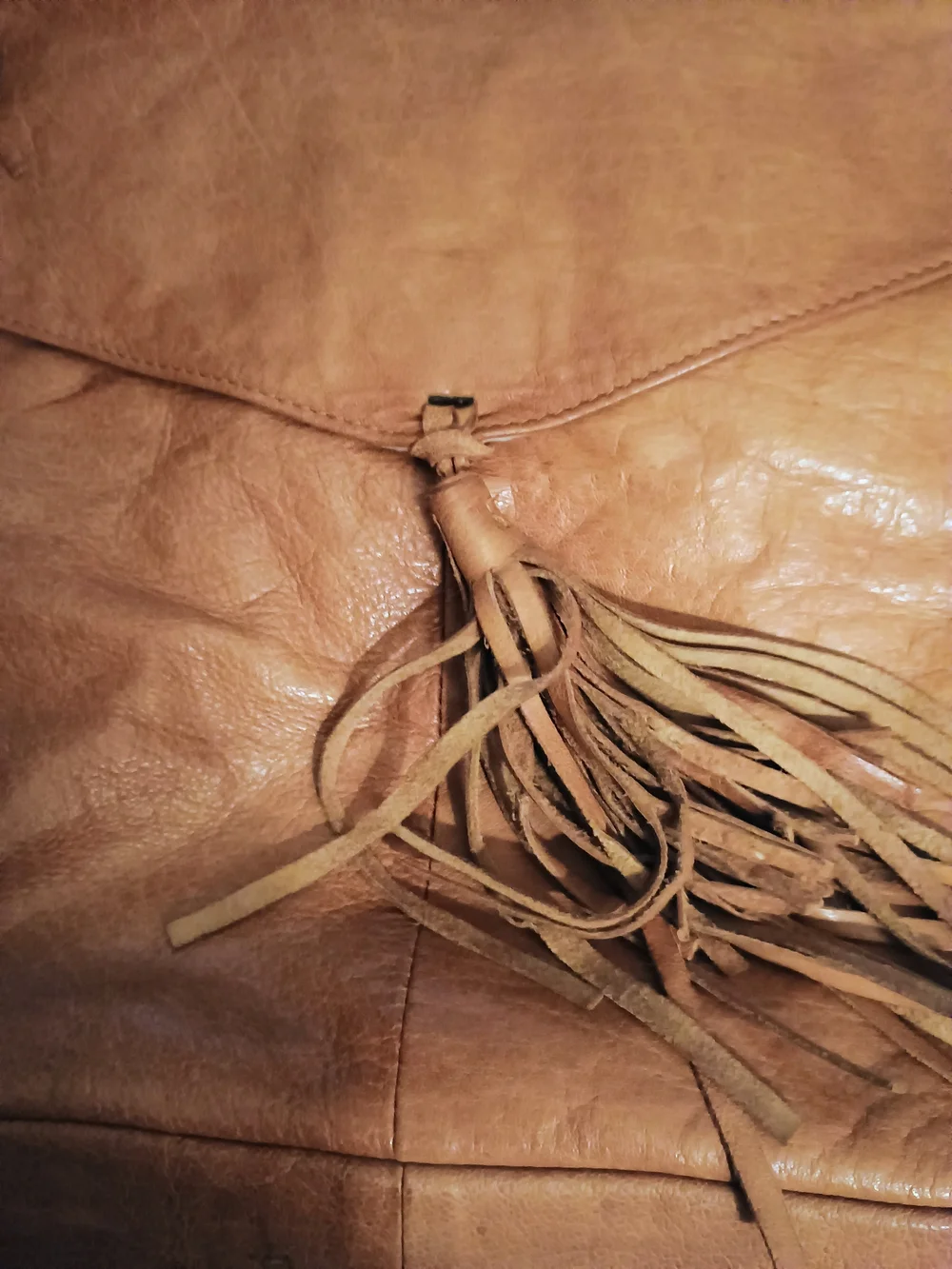 ANTHROPOLOGIE!! LEATHER TAN W/TASSELS!! 14 IN X 14 IN
